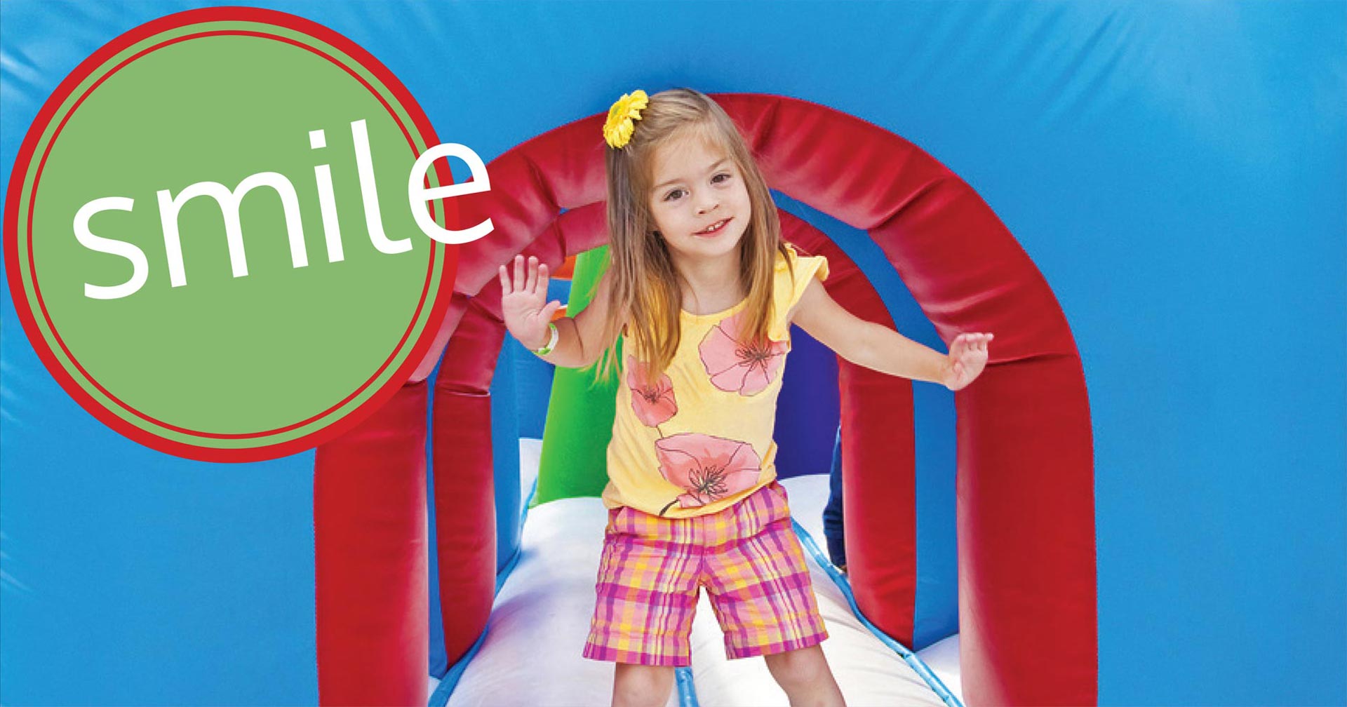 girl playing in interactive jumphouse